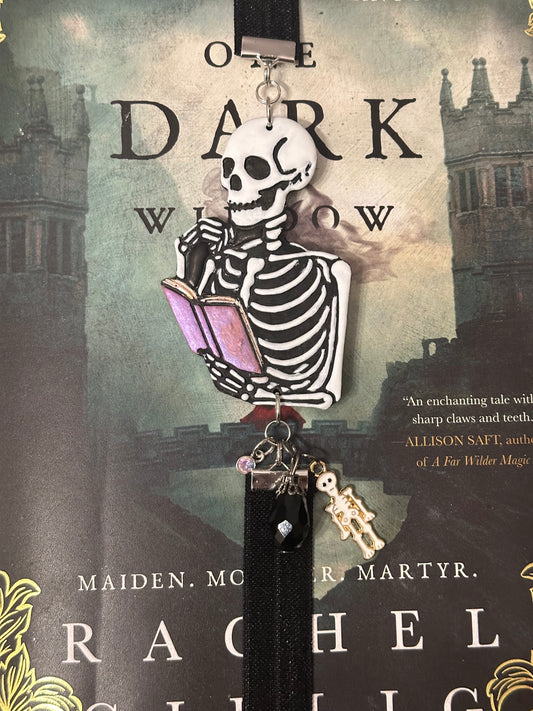 Spooky Skeleton Reading a Book – Handmade Polymer Clay Elastic Bookmark with Beads & Charms