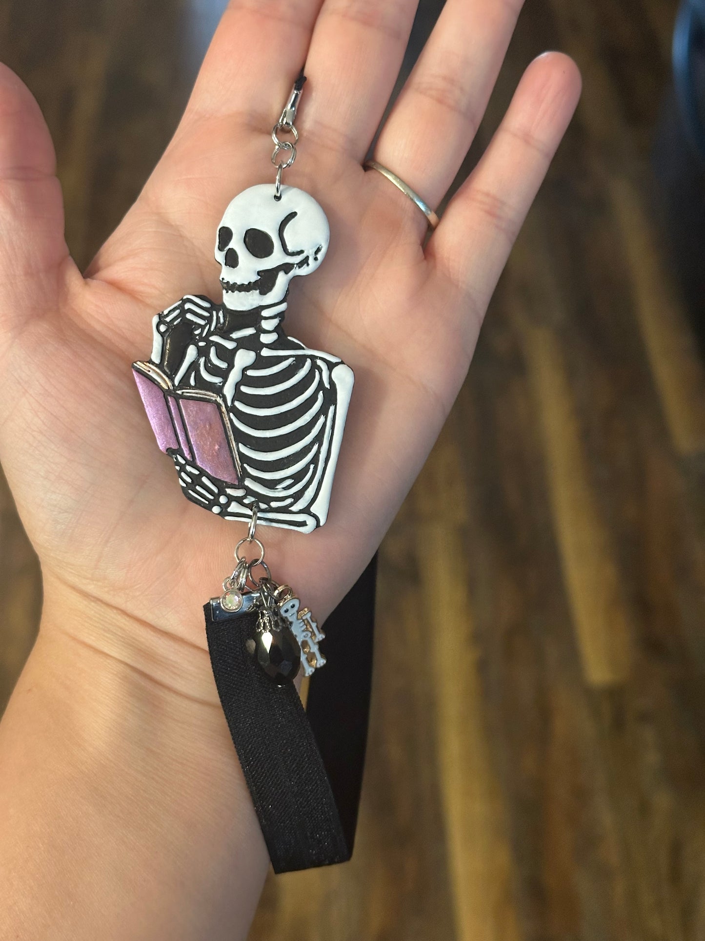 Spooky Skeleton Reading a Book – Handmade Polymer Clay Elastic Bookmark with Beads & Charms