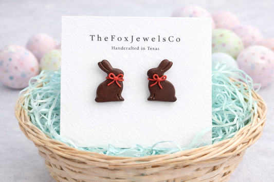 Handmade chocolate bunny stud earrings made from polymer clay with a red bow, cute Easter bunny jewelry.