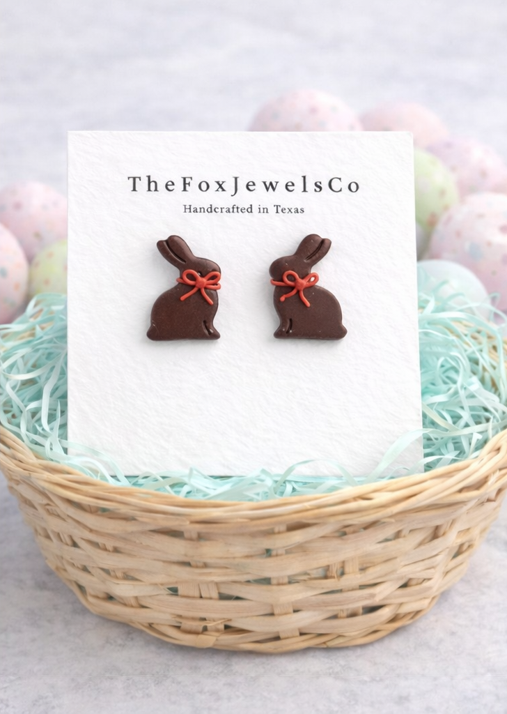Handmade chocolate bunny stud earrings made from polymer clay with a red bow, cute Easter bunny jewelry.